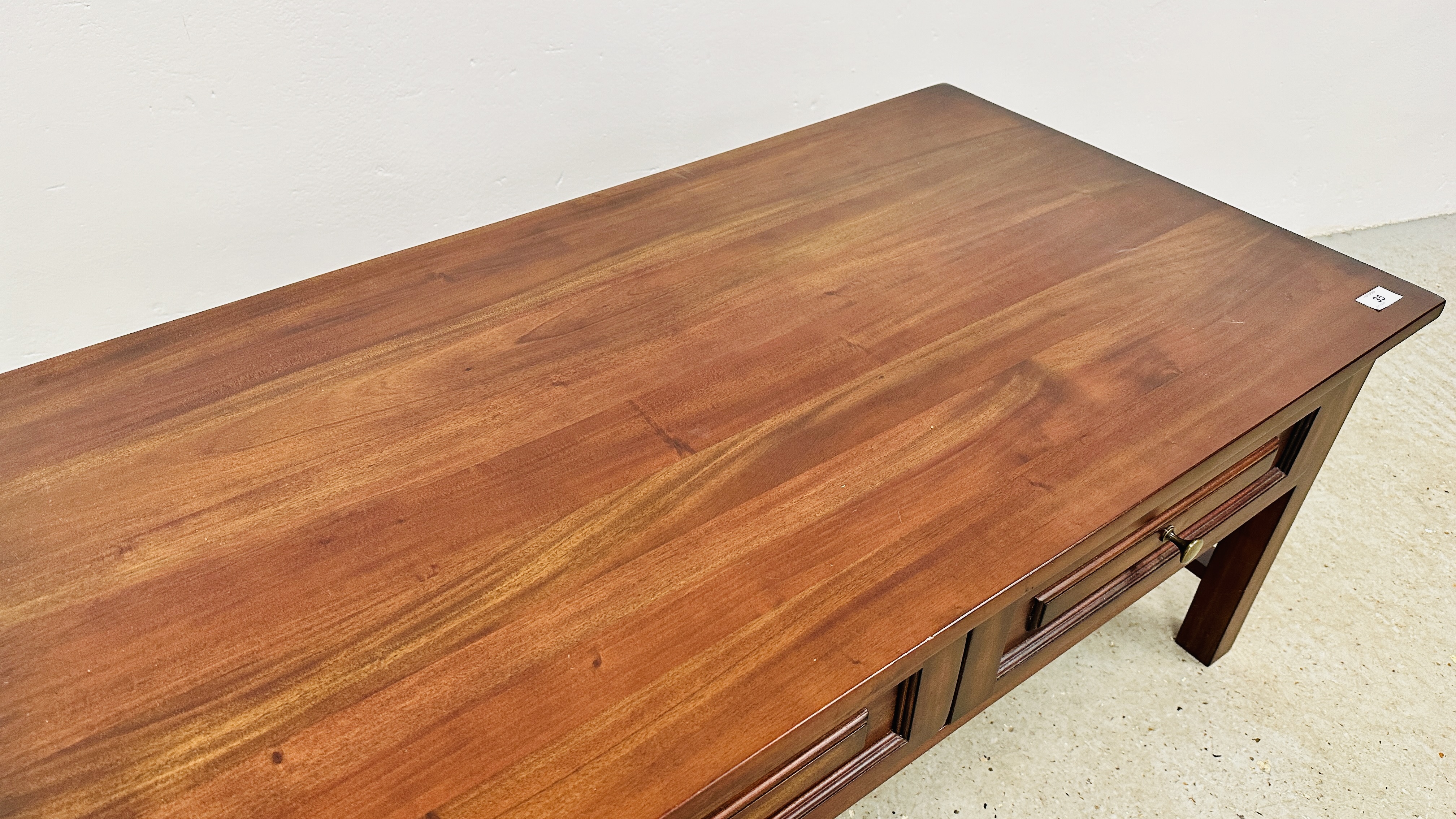 A DARK WOOD TWO DRAWER RECTANGULAR COFFEE TABLE - 110CM X 60CM. - Image 7 of 9