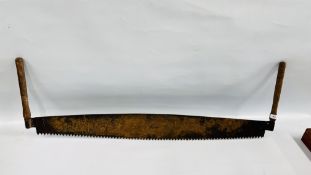 A VINTAGE TWO HANDLED LUMBER SAW.