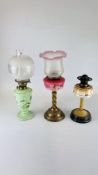 THREE OIL LAMPS - ONE ART DECO, ONE WITH GREEN GLASS DECORATED WITH FLOWERS,