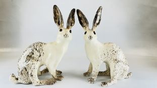 A PAIR OF WINSTANLEY HARES - HEIGHT 40 CM A/F.