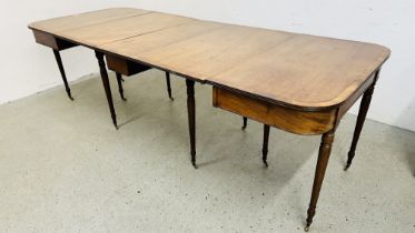 A GEORGIAN MAHOGANY "D" END EXTENDING DINING TABLE WITH CENTRAL SECTION AND TWO FURTHER EXTENSION