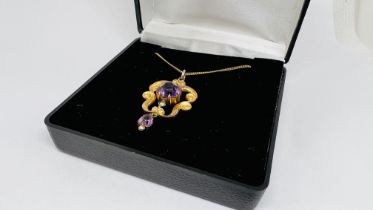 A PERIOD 9CT GOLD PENDANT SET WITH CENTRAL AMETHYST ON A FINE YELLOW METAL GOLD CHAIN (INDISTINCT