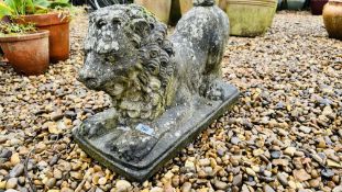 A STONEWORK EXAMPLE OF A LION - HEIGHT 35CM X LENGTH 55CM.