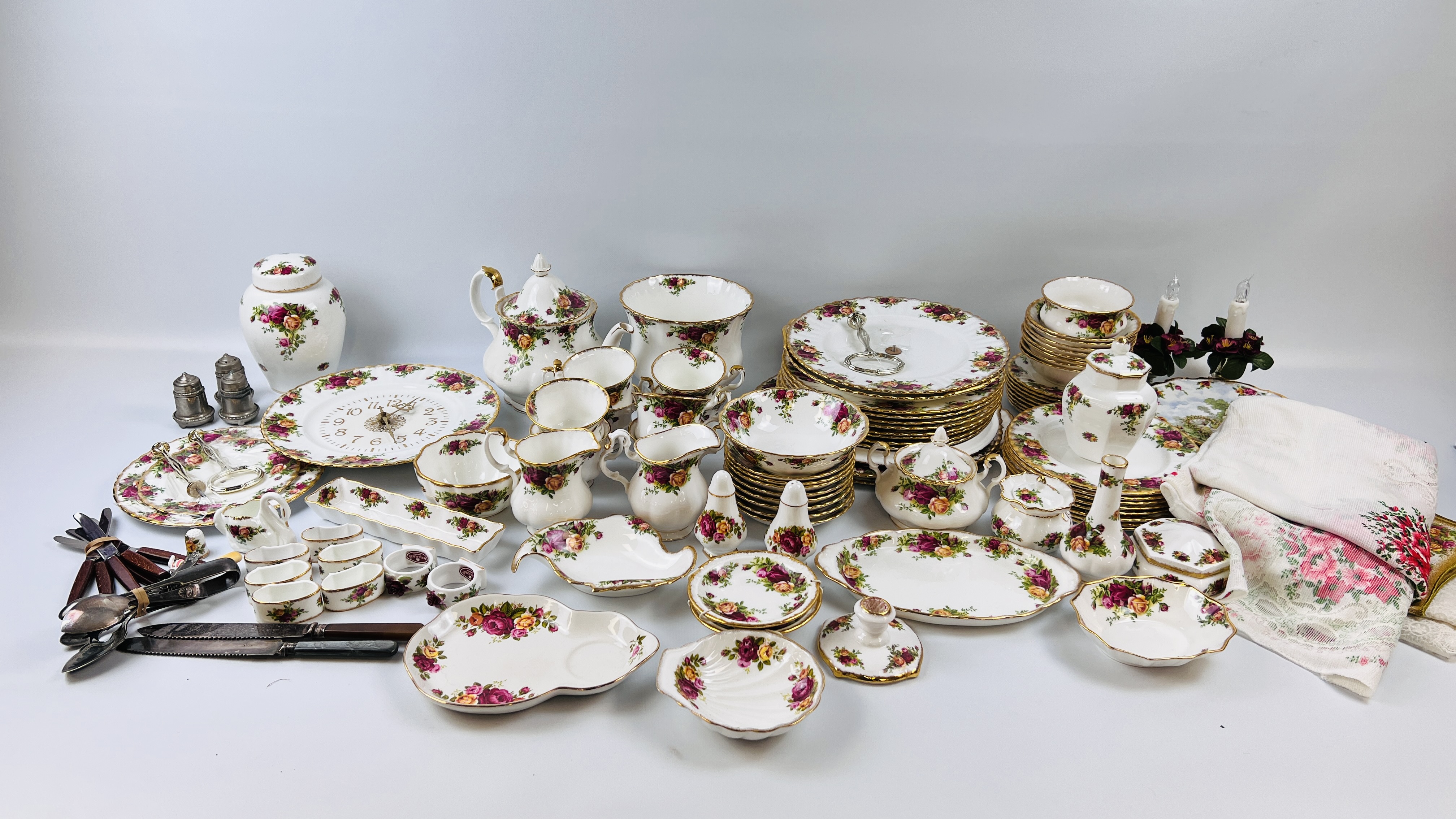 APPROXIMATELY 80 PIECES OF ROYAL ALBERT OLD COUNTRY ROSE TEA AND DINNER WARE AND CABINET ORNAMENTS
