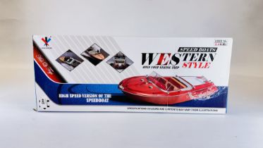 A BOXED WESTERN STYLE RC SPEED BOAT, TWO BATTERIES, CHARGER AND CONTROLLER - SOLD AS SEEN.