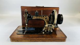 ANTIQUE FRISTER & ROSSMAN MANUAL SEWING MACHINE IN CASE WITH ORIGINAL INSTRUCTIONS AND KEY.