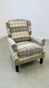 A MODERN CREAM CHECK UPHOLSTERED EASY CHAIR.