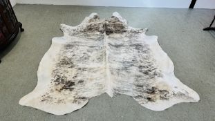 A COW SKIN RUG 234CM LONG.