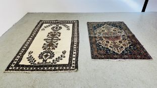 AN EASTERN RUG ON A BLUE BACKGROUND 155CM X 106CM ALONG WITH ONE OTHER EASTERN WOOL RUG ON A BROWN