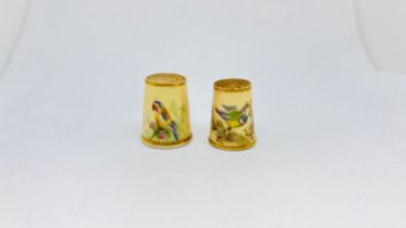 TWO WORCESTER BLUSH IVORY THIMBLES DECORATED WITH A GOLDFINCH AND BLUETIT, THE LARGER 2.5CM H.