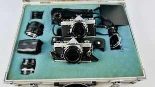 A PAIR OF OLYMPUS OM-1 SLR CAMERA BODIES COMPLETE WITH 4 LENSES TO INCLUDE TELEPLUS 2 X SUPER