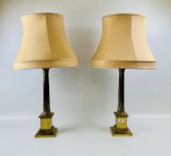 A PAIR OF HEAVY GILT FINISHED COLUMNED TABLE LAMPS - WIRES REMOVED.