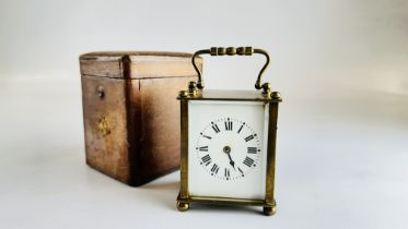 FRENCH CARRIAGE CLOCK IN FITTED LEATHER CASE AND KEY.