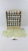 A MODERN CREAM FINISHED SPICE RACK ALONG WITH FRANKLIN MINT SPICE JARS.