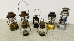 A GROUP OF 7 ASSORTED VINTAGE TILLEY LAMPS.