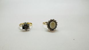 AN 18CT GOLD FLOWER HEAD RING SET WITH A CENTRAL DIAMOND SURROUNDED BY SMALLER OPALS (ONE MISSING