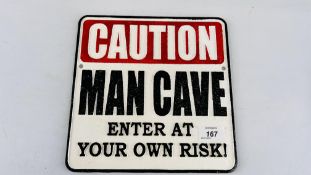 (R) CAUTION MAN CAVE SIGN.