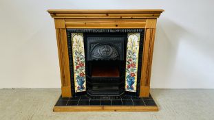 A MODERN ELECTRIC FIRE MOUNTED IN TILED AND PINE SURROUND (SUNCREST) W 123CM X H 114CM - SOLD AS