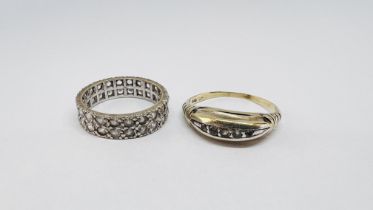 A 9CT WHITE GOLD ETERNITY RING (MISSING 2 STONES) + A VINTAGE 5 STONE RING MARKED 333.