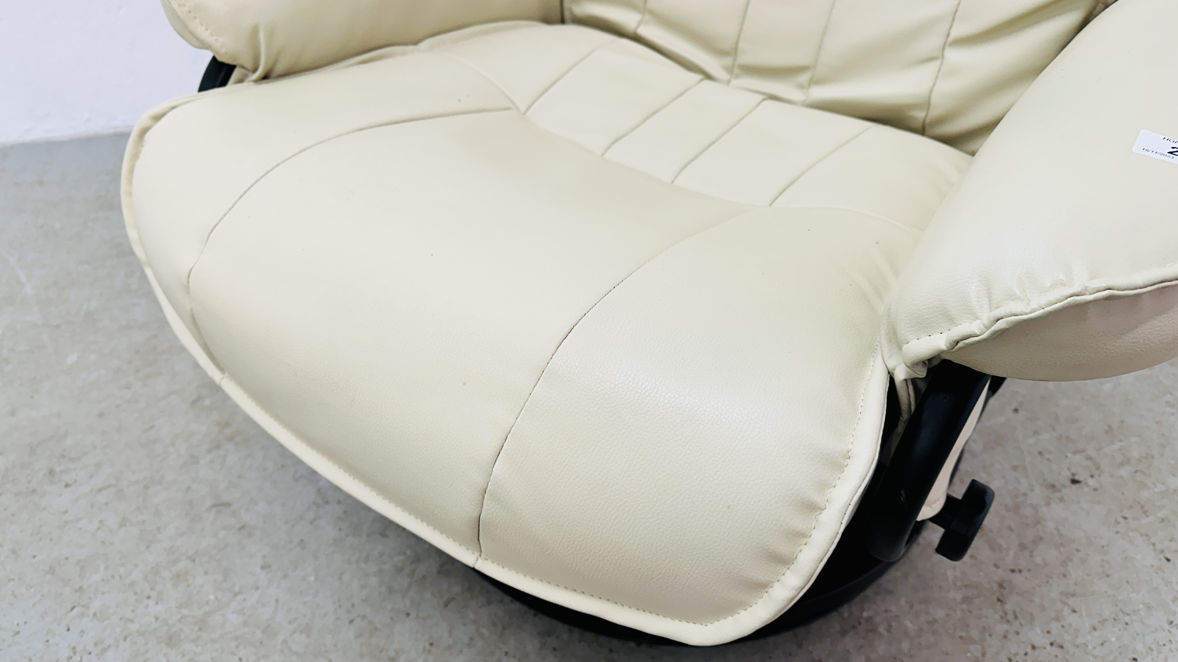 A MODERN CREAM FAUX LEATHER RECLINING RELAXER CHAIR AND FOOTSTOOL. - Image 8 of 12