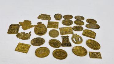 APPROXIMATELY 27 BRASS WAGON PLAQUES.