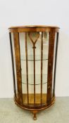 A VINTAGE MAHOGANY FINISH BOW FRONT DISPLAY CABINET.