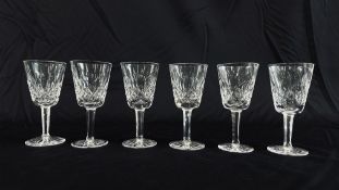 A SET OF SIX WATERFORD CRYSTAL "LISMORE" WHITE WINE GLASSES.
