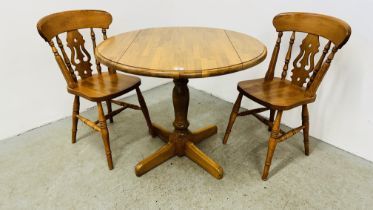 A MODERN BEECH WOOD DROP SIDE CIRCULAR TABLE AND A PAIR OF MATCHING CHAIRS.