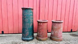 A GROUP OF THREE VINTAGE CHIMNEY POTS.