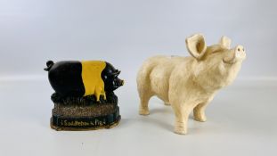 A CAST METAL SADDLEBACK PIG DOOR STOP ALONG WITH A FURTHER FIGURE OF A PIG.