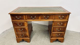 A MODERN YEW WOOD FINISH 9 DRAWER TWIN PEDESTAL DESK WITH GREEN LEATHER TOP AND BRASS HANDLES,