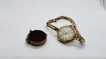 A VINTAGE 9CT GOLD CASED WRIST WATCH MARKED EVERITE ON A ROLLED GOLD EXPANDABLE STRAP, 9CT GOLD FOB.