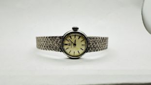 A LADIES OMEGA COCKTAIL WATCH ON 9CT WHITE GOLD BRAIDED BRACELET.