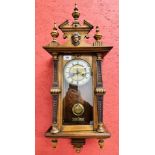 ORNATE OAK CASED STRIKING DROP DIAL WALL CLOCK - OVERALL HEIGHT 80CM.