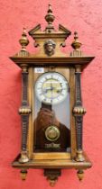 ORNATE OAK CASED STRIKING DROP DIAL WALL CLOCK - OVERALL HEIGHT 80CM.