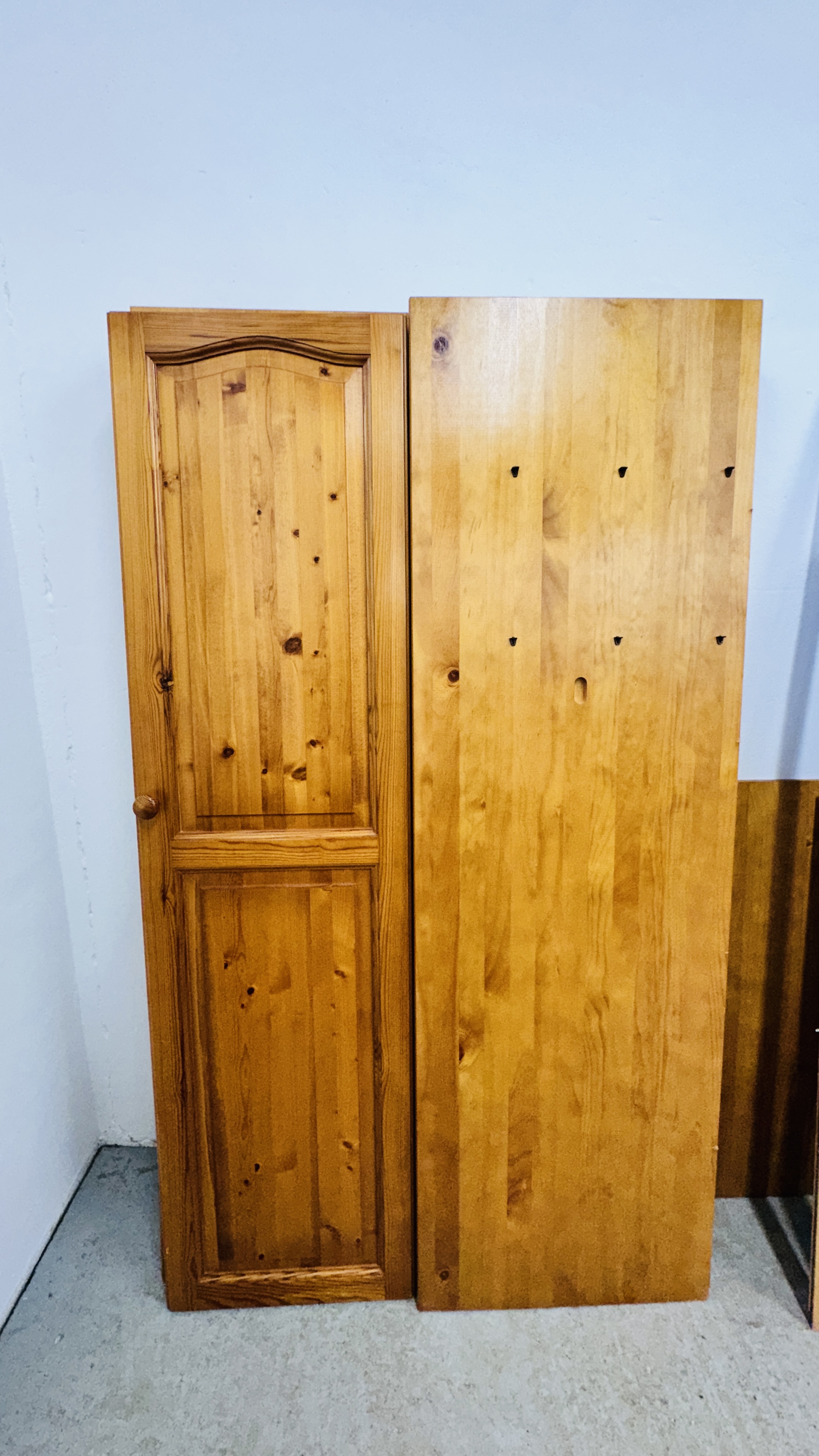 A HONEY PINE TWO DOOR WARDROBE AND A HONEY PINE TRIPLE WARDROBE (DISASSEMBLED). - Image 8 of 9