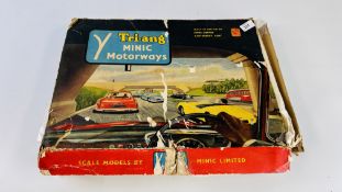 A BOXED TRI-ANG MINIC MOTORWAYS TRACK AND TWO BUSES.
