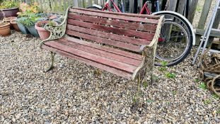 GARDEN BENCH WITH ORNATE CAST METAL ENDS.
