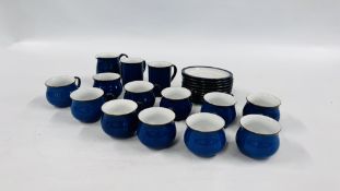 A COLLECTION OF BLUE DENBY TEA WARE TO INCLUDE 10 CUPS, 2 MUGS, SUGAR BOWL, MILK JUG AND 9 SAUCERS.