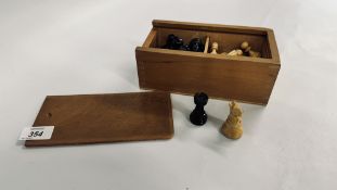 A VINTAGE STYLE WOODEN TURNED CHESS SET IN A WOODEN BOX.