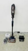 A SHARK DUO CLEAN CORDLESS VACUUM CLEANER COMPLETE WITH FIVE BATTERIES AND 2 X CHARGERS - SOLD AS