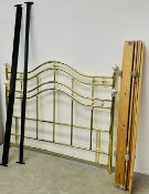 A BRASS FINISHED METAL BED FRAME.