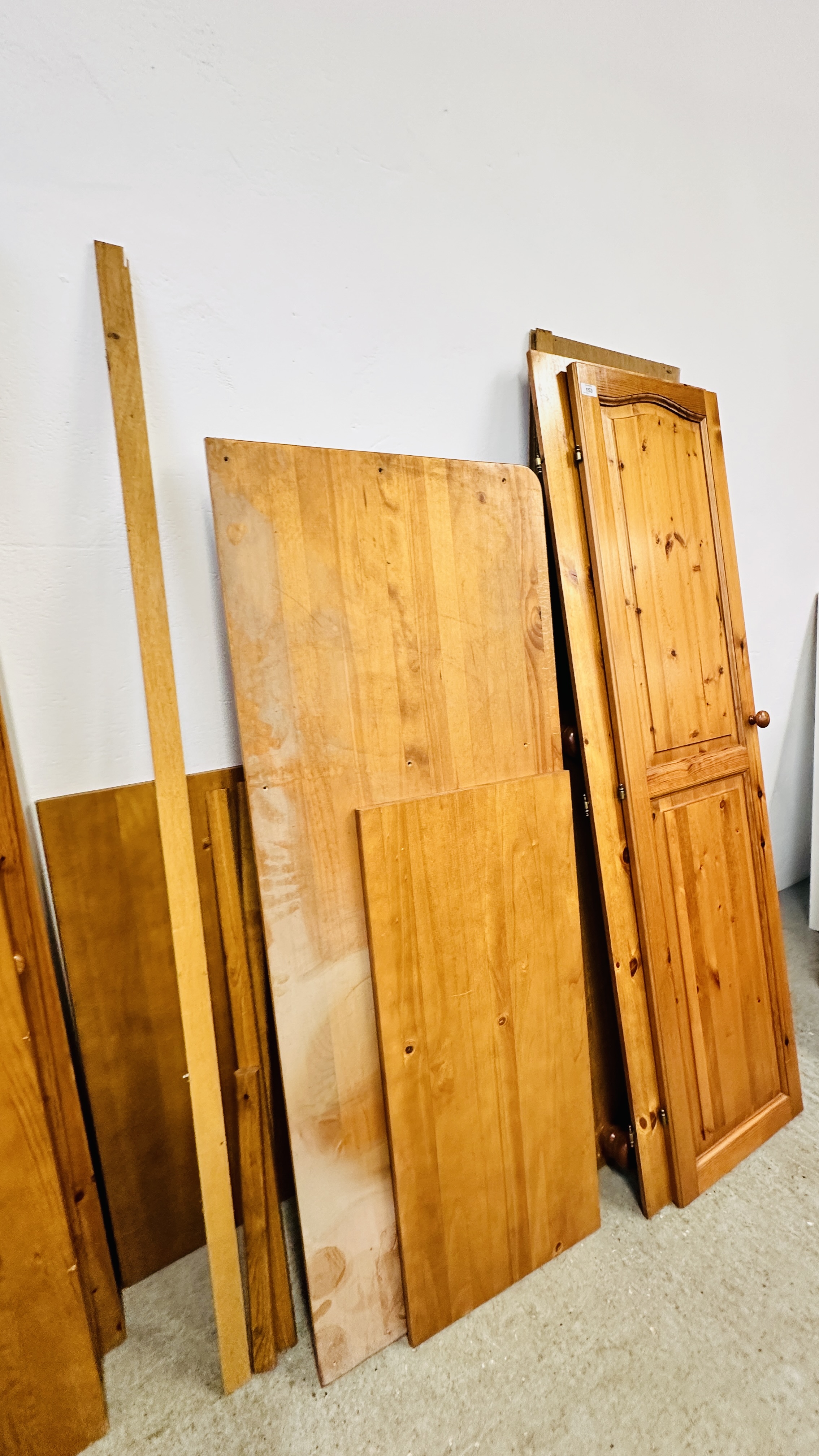 A HONEY PINE TWO DOOR WARDROBE AND A HONEY PINE TRIPLE WARDROBE (DISASSEMBLED). - Image 9 of 9