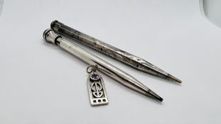 A SILVER PENDANT IN THE RENNIE MACKINTOSH STYLE ALONG WITH A VINTAGE SILVER PENCIL AND A WHITE