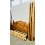 A HONEY PINE KING SIZE BED FRAME.