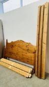 A HONEY PINE KING SIZE BED FRAME.
