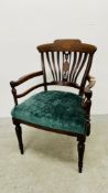 ANTIQUE MAHOGANY AND INLAID OPEN ARM CHAIR WITH GREEN VELOUR SEAT.