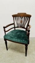 ANTIQUE MAHOGANY AND INLAID OPEN ARM CHAIR WITH GREEN VELOUR SEAT.