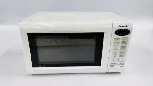 A PANASONIC WHITE FINISH MICROWAVE - SOLD AS SEEN.