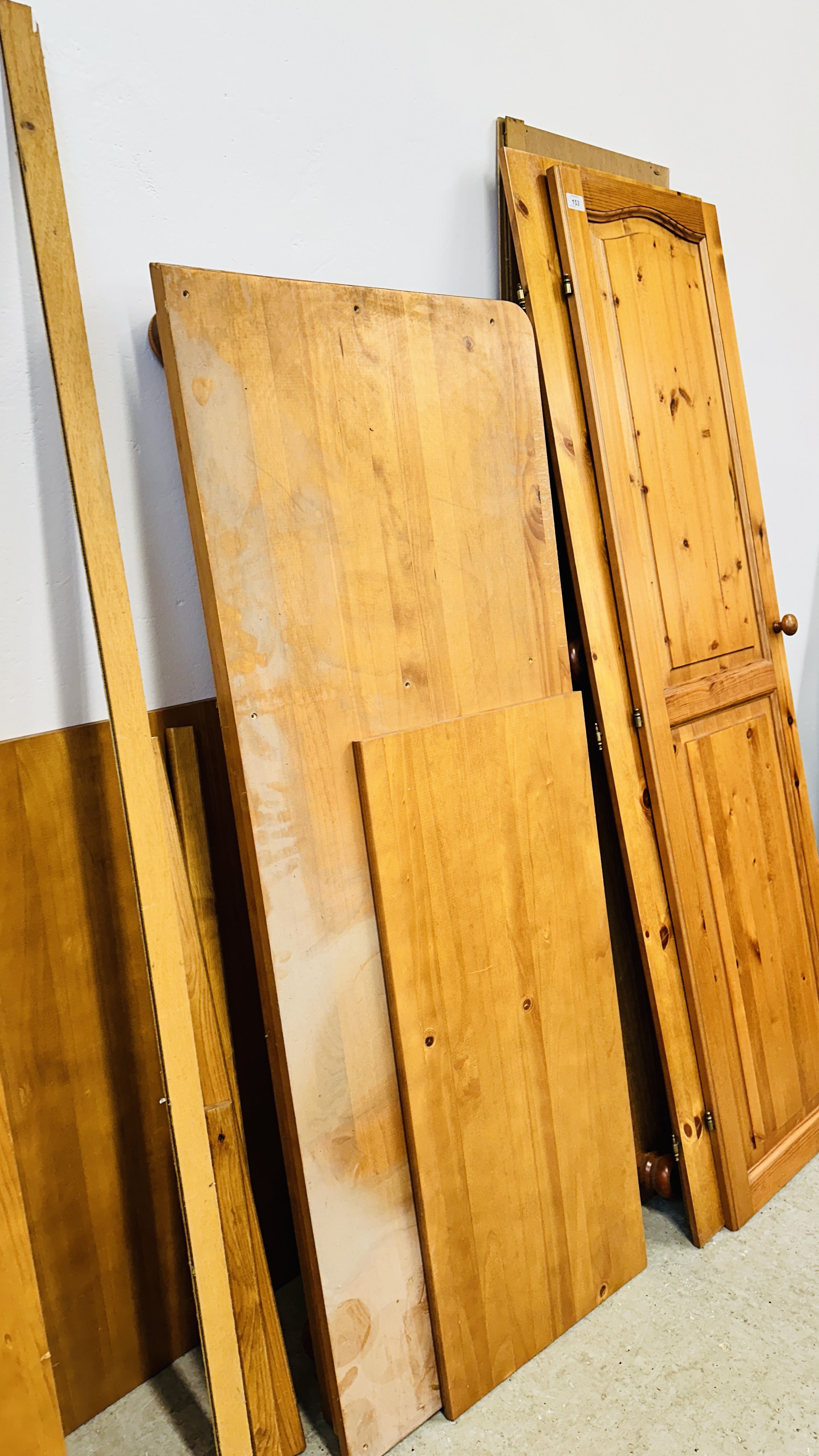 A HONEY PINE TWO DOOR WARDROBE AND A HONEY PINE TRIPLE WARDROBE (DISASSEMBLED). - Image 7 of 9